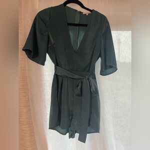 Short green romper with low v neck